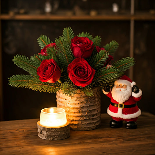 Elegant Christmas flower bouquet with red roses, white lilies, and festive greenery, perfect for holiday gifting in Dubai.